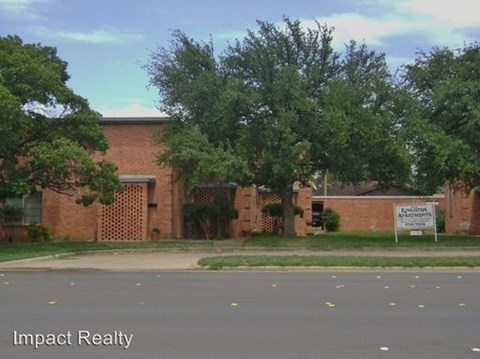 A building with a sign that says Impact Realty.