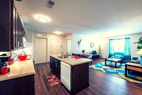 a kitchen and living room with a counter top
