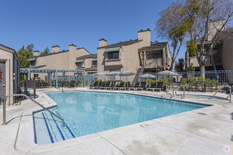 Pool with seating l Quailwood Apts in Stockton 