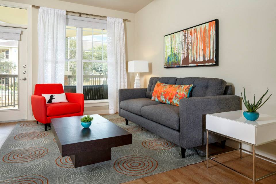 Living Room with balcony access and faux-wood flooring
