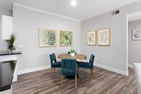 the retreat dining room with table and chairs and fireplace