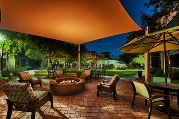 Fire pit at night with chairs surrounding it - Photo Gallery 4