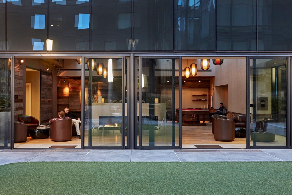 a view of the lobby of a building with glass doors