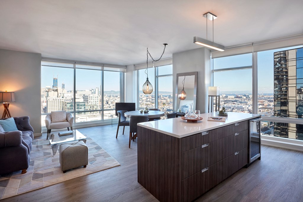 a kitchen and living room with a view of the city