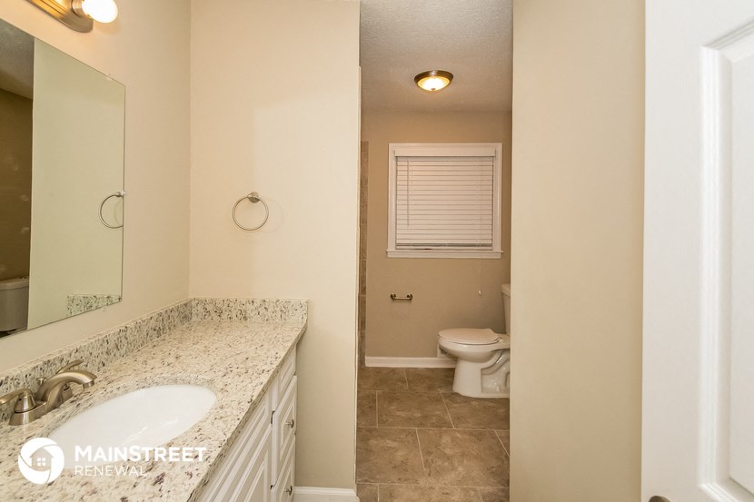 a bathroom with a sink and a toilet in it