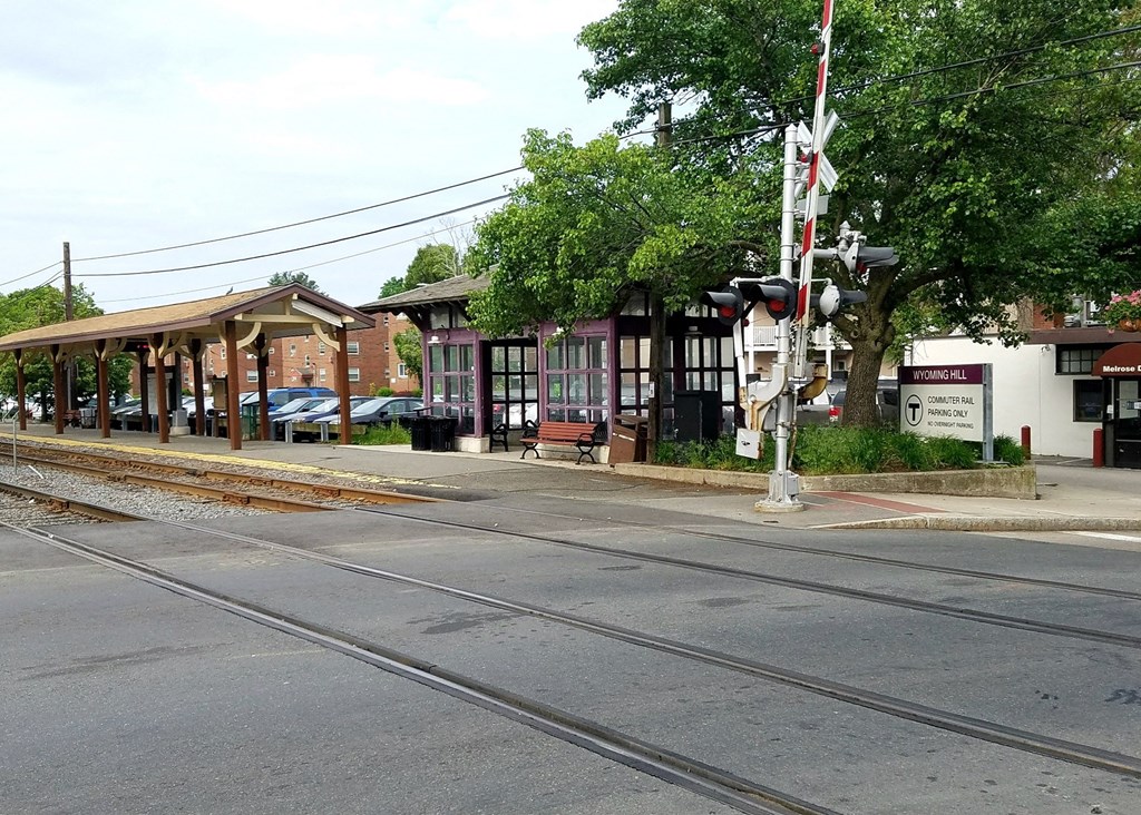 a train station on the side of an empty street