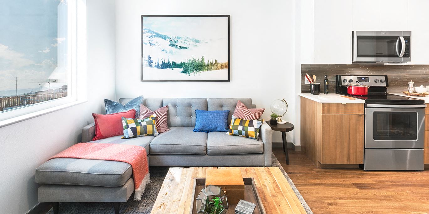 a living room with a couch and a table