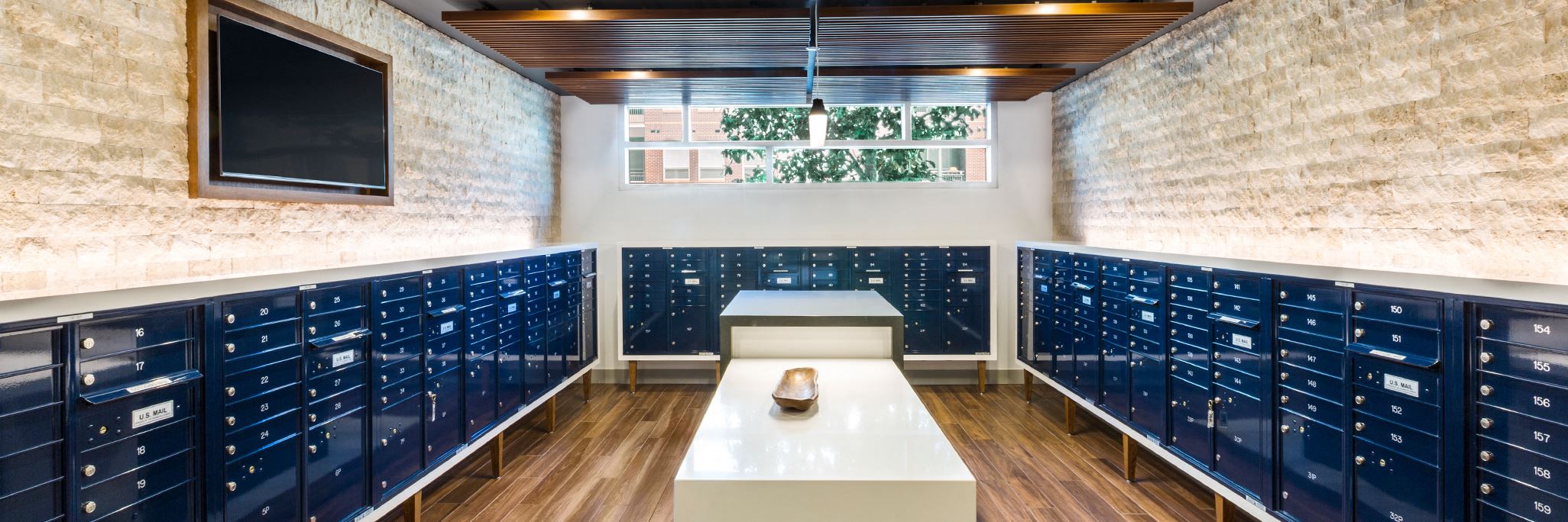 a locker room with blue lockers and a window