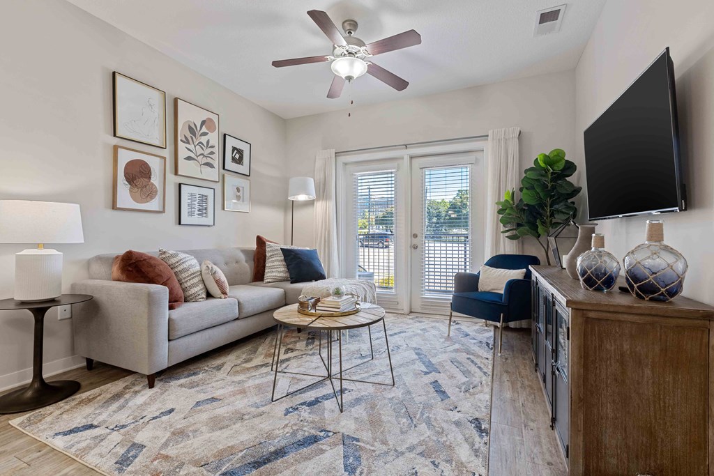 a living room with a couch and a tv
