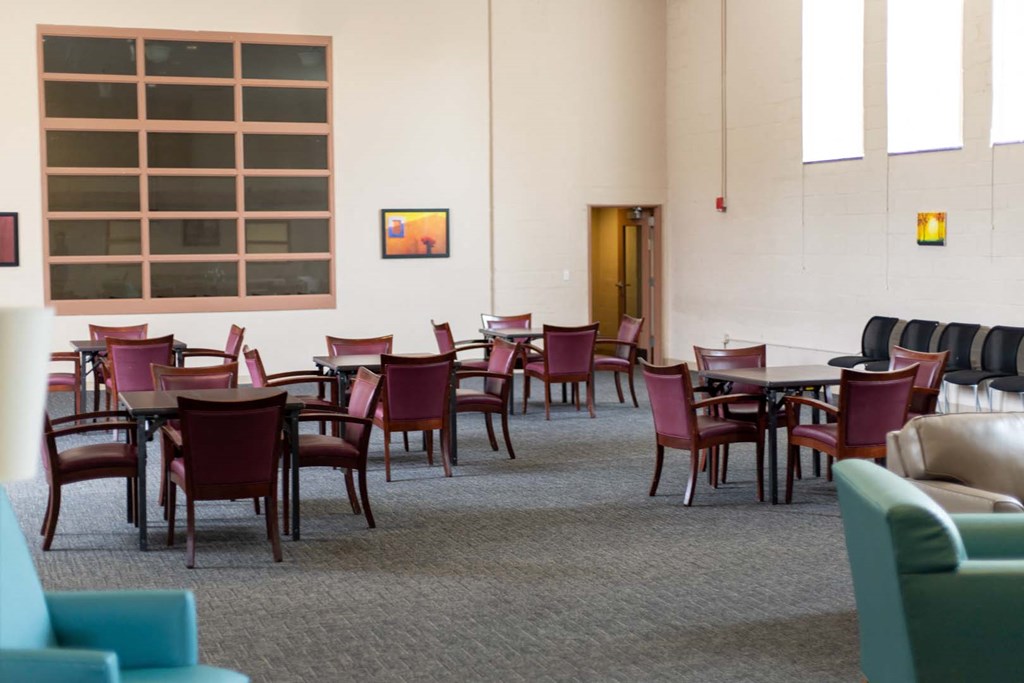 a dining room with chairs and tables