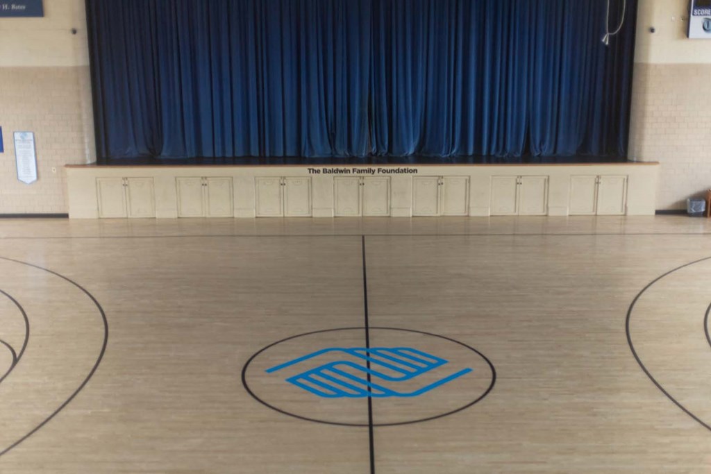 a view of the floor of a gym with a blue