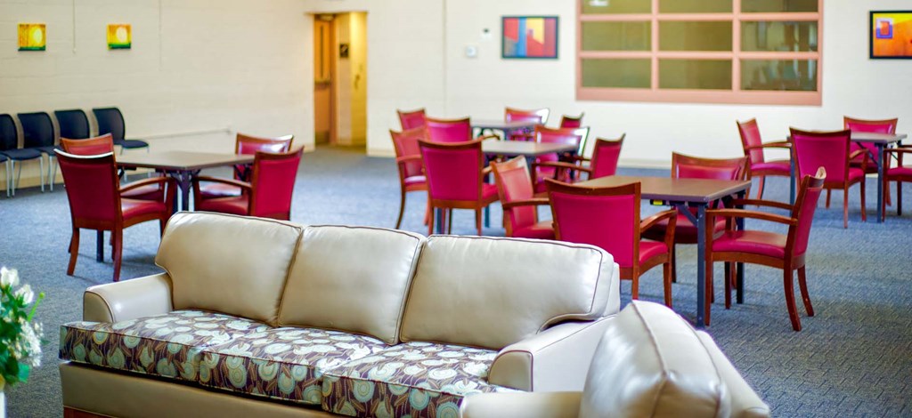 a living room with tables and chairs and a couch