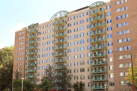 a large apartment building with many balconies on the side of it