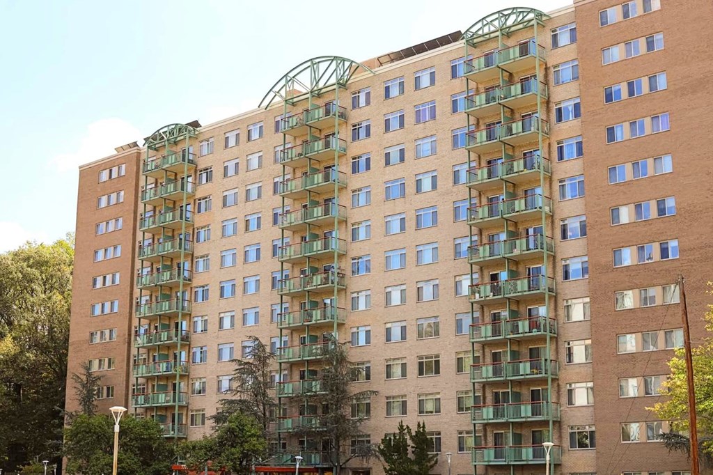a large apartment building with many balconies on the side of it
