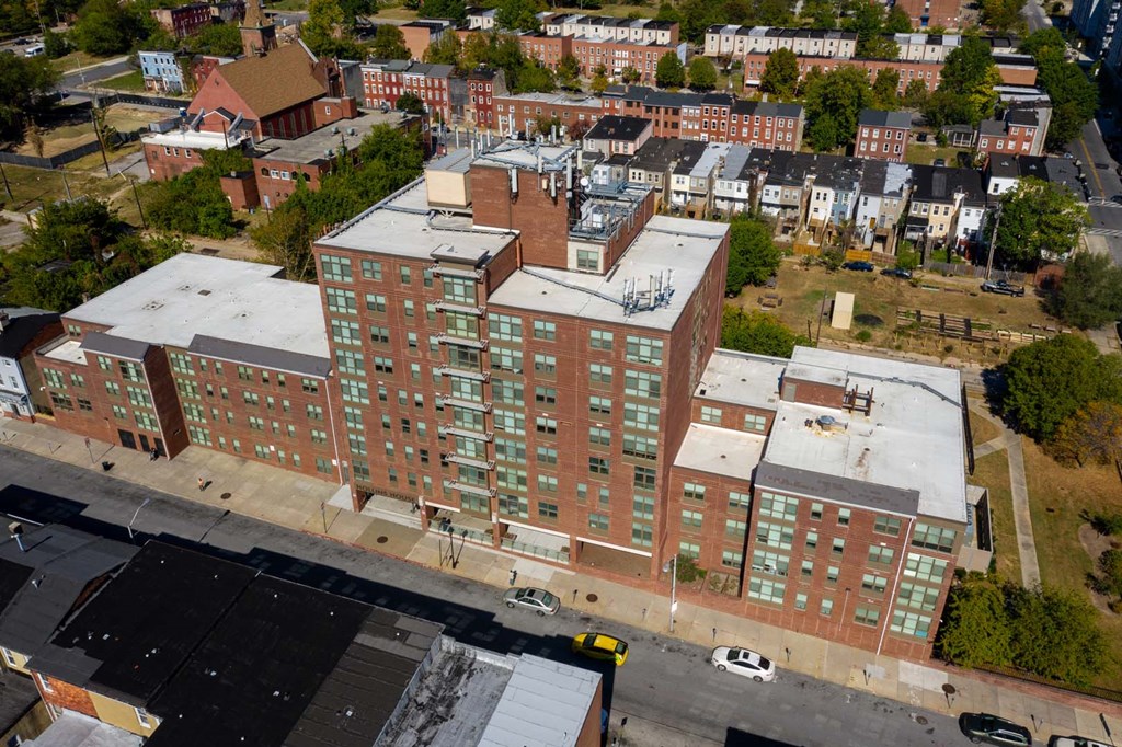 an aerial view of an apartment building in the city