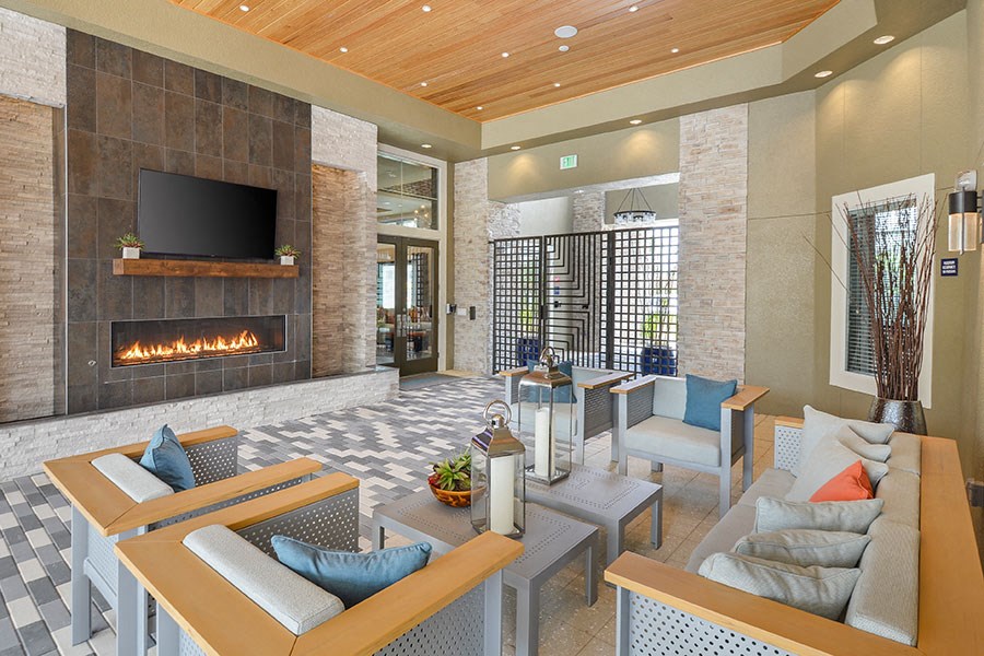 a living room with a fireplace and a television
