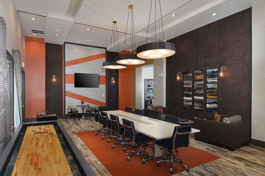 a conference room with a long table and chairs