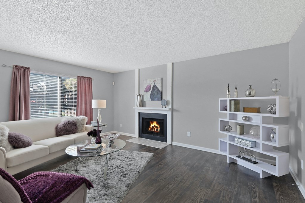 a living room with a fireplace and a couch