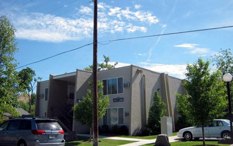 a building with cars parked in front of it