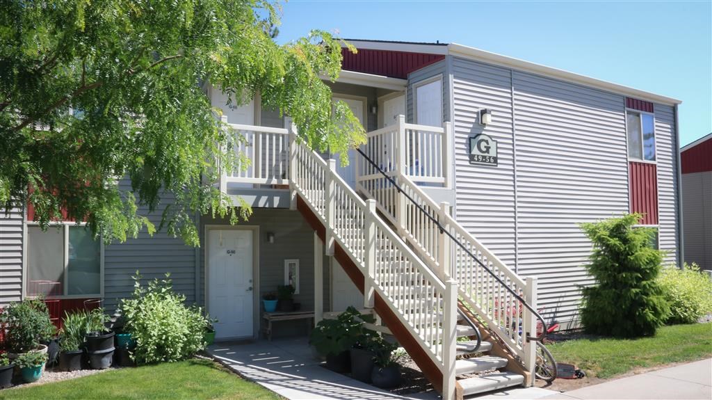 a building with stairs and a guitar sign on the side of it