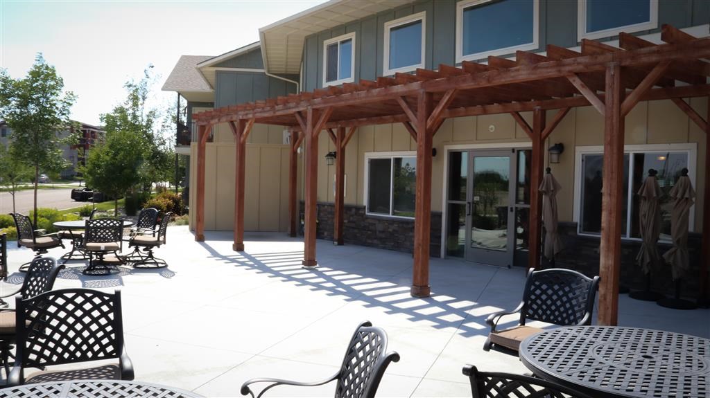 a patio with chairs and tables on a patio