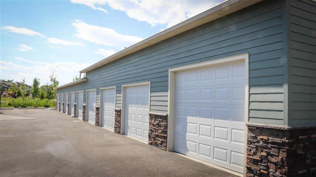 a row of garage doors on the side of a building
