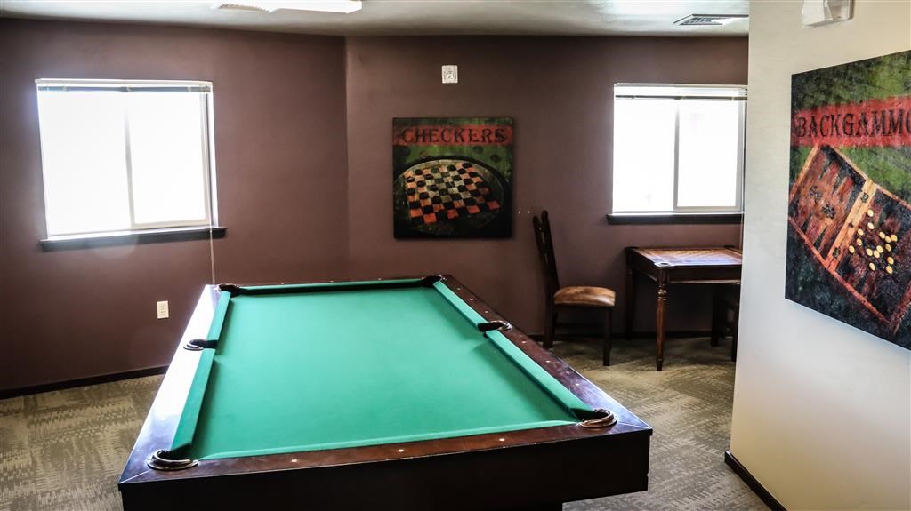 a game room with a pool table