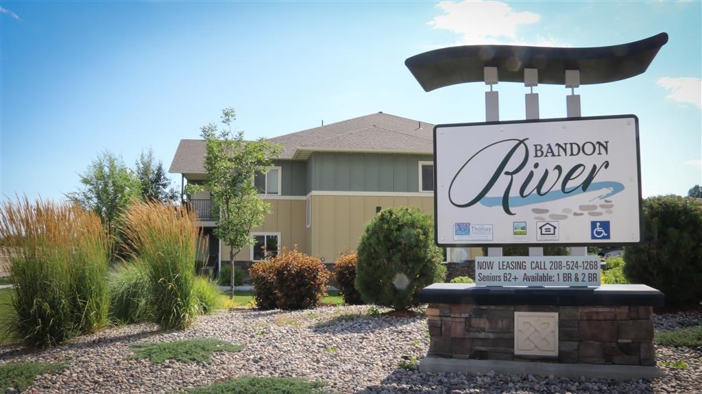 a sign in front of a house with a sign