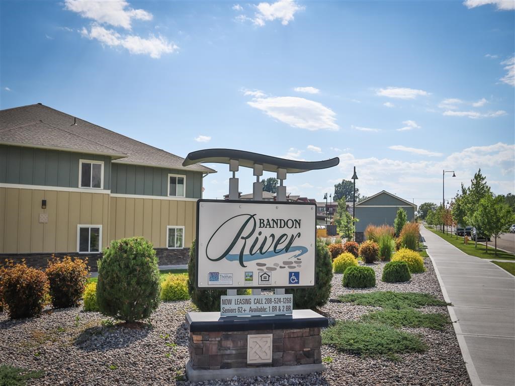 a sign in front of a house with a sign