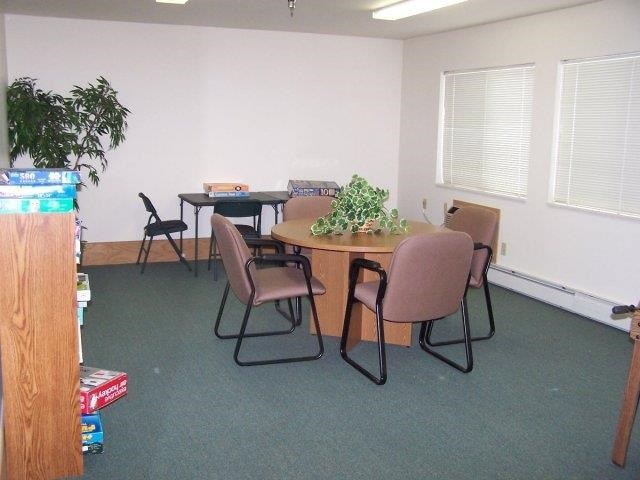 a conference room with a table and chairs