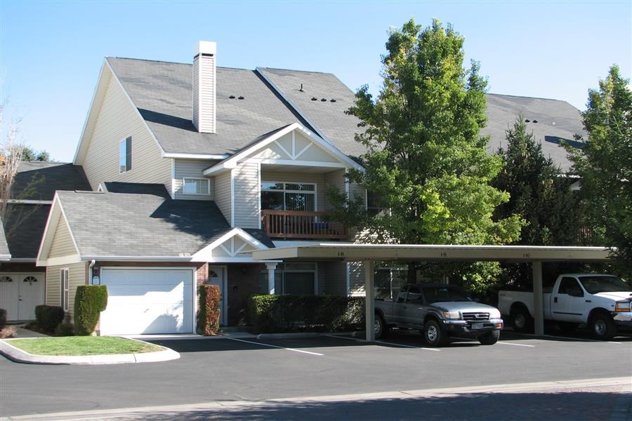 a house with a car parked in the driveway