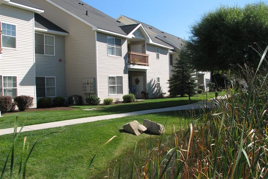 a house with a sidewalk in front of it