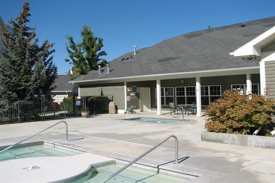 a swimming pool in front of a house