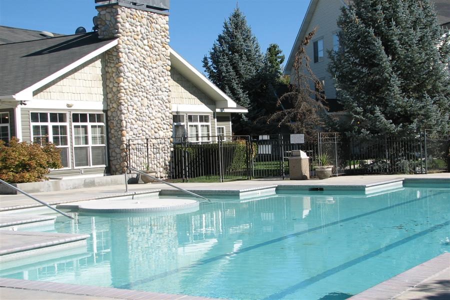 a swimming pool in front of a house