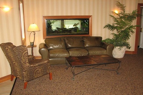 a living room with a leather couch and a table
