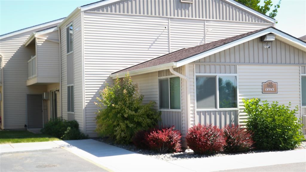 a white house with a sign on the side of it