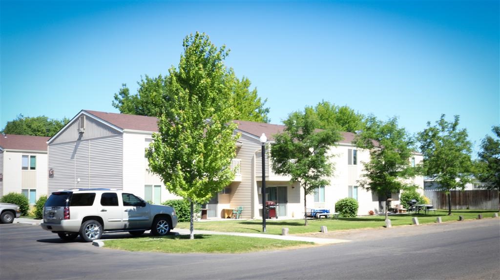 a white truck parked in front of houses