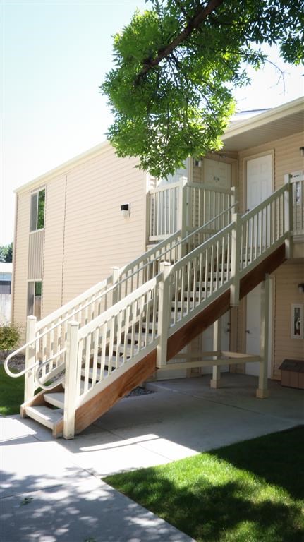 a house with a porch and a white staircase