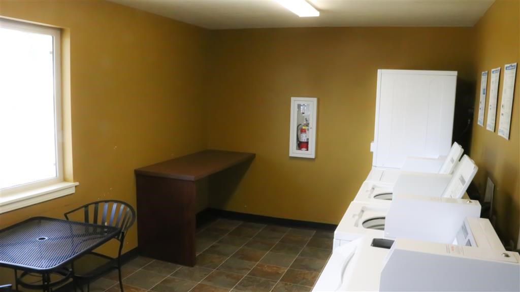 a kitchen with a stove and a table