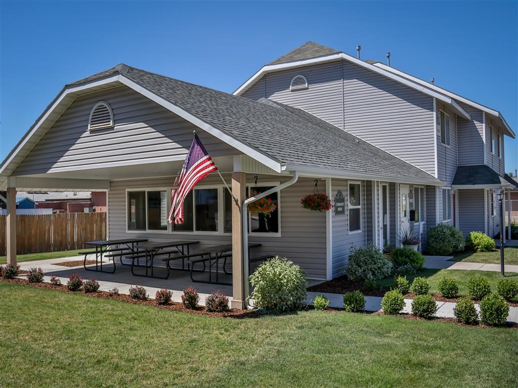 a house with an flag in the front yard