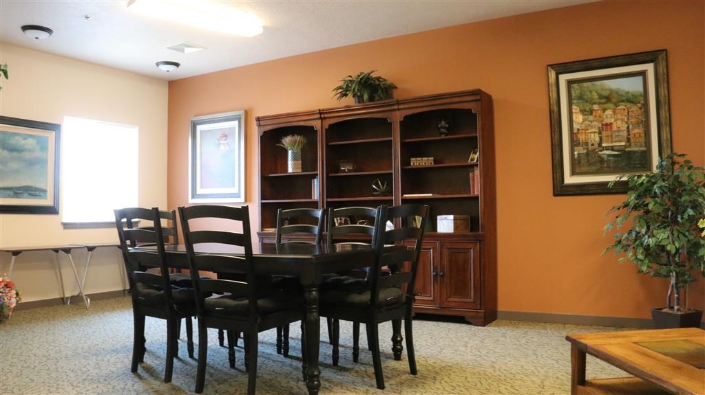 a dining room with a table and chairs