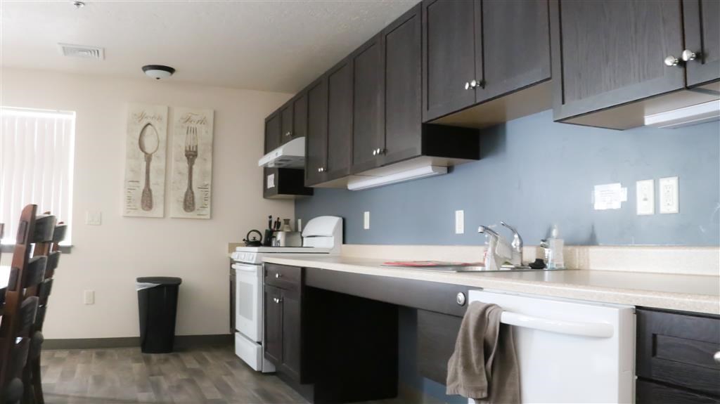 a kitchen with a stove and a sink