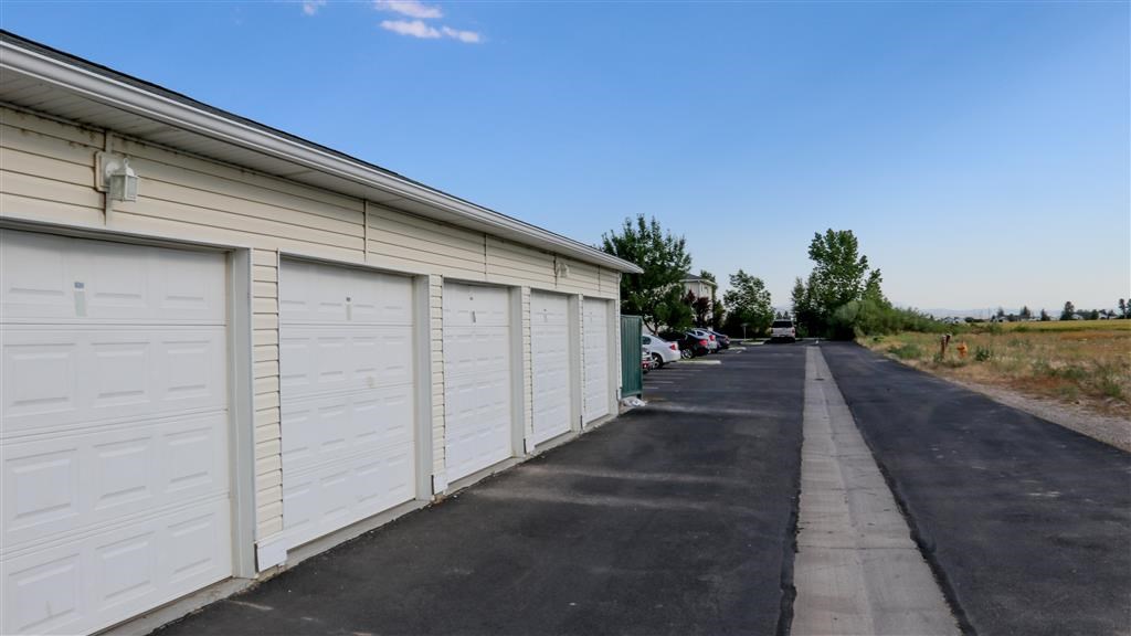 a row of garage doors on the side of a building