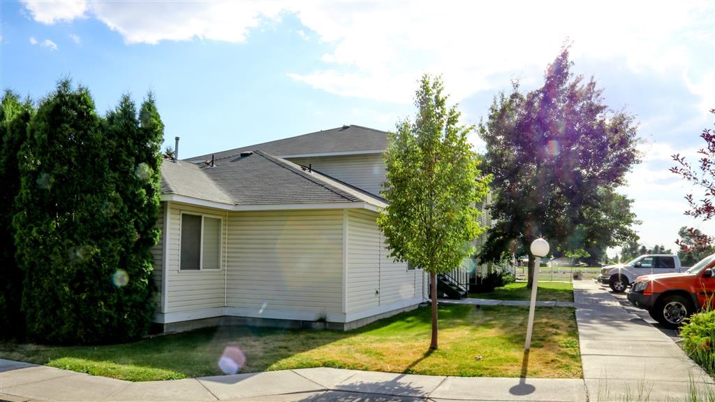 a white house on the side of a street