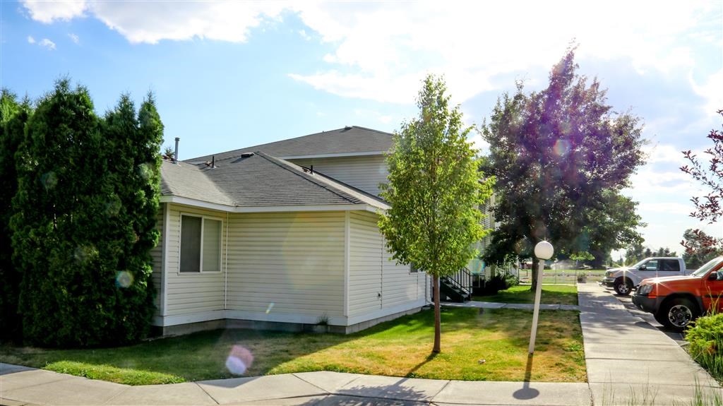 a white house on the side of a street