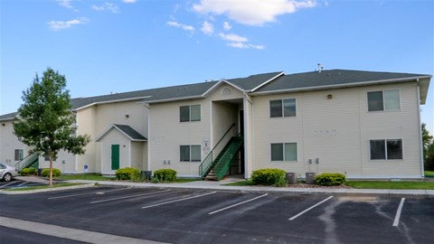 an apartment building with a parking lot
