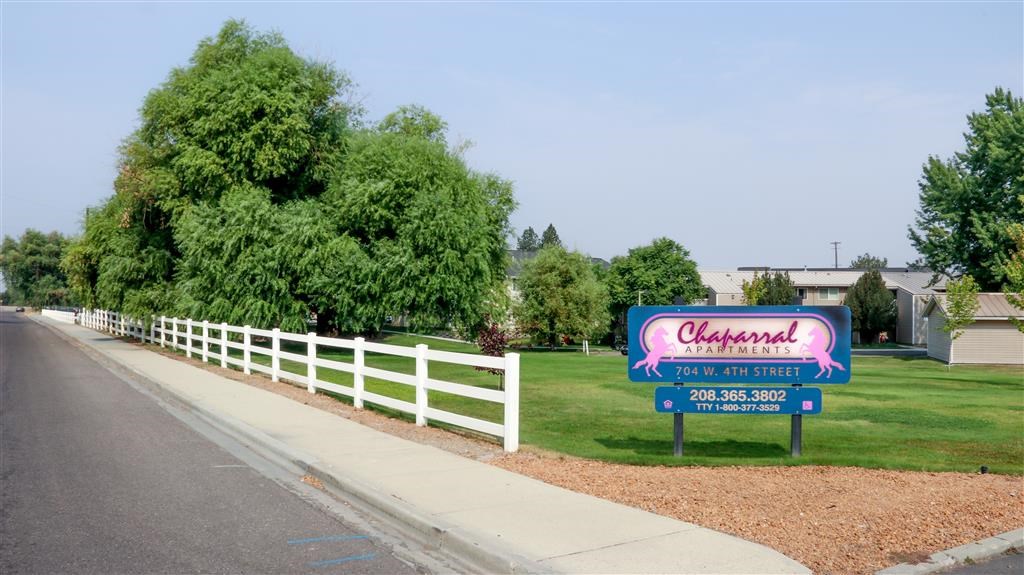 a sign is on the side of the road