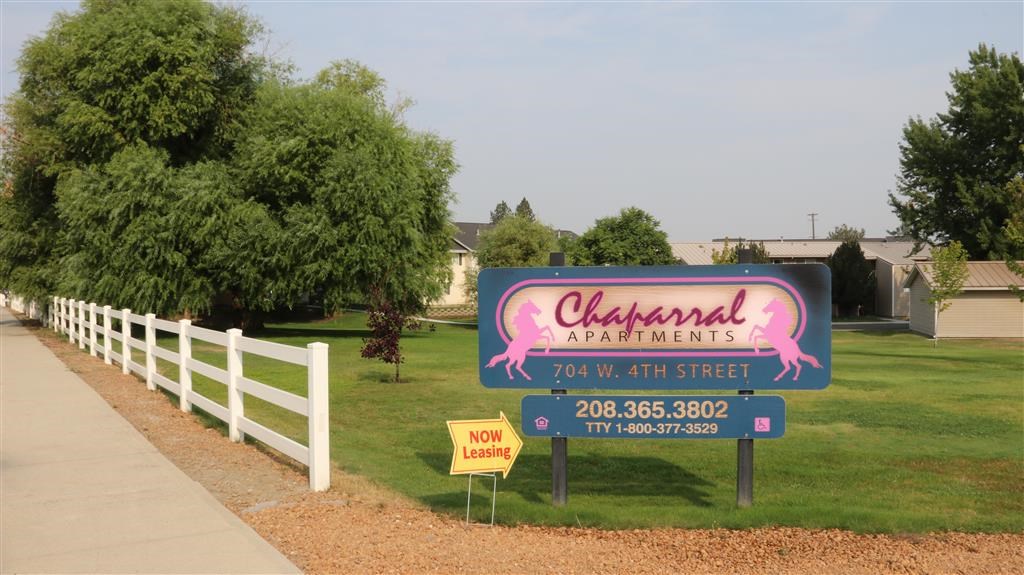 a sign for a restaurant on the side of a street