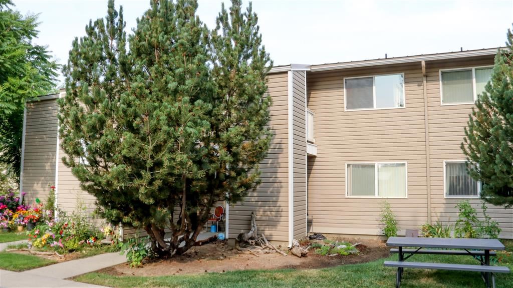 a building with a picnic table in front of it