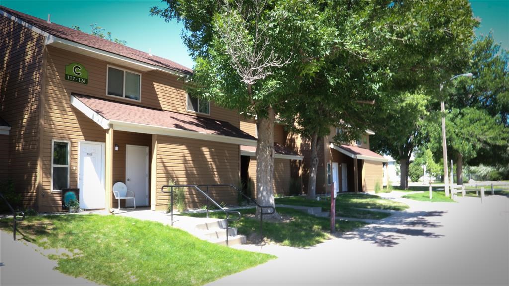 a building with a tree in front of it